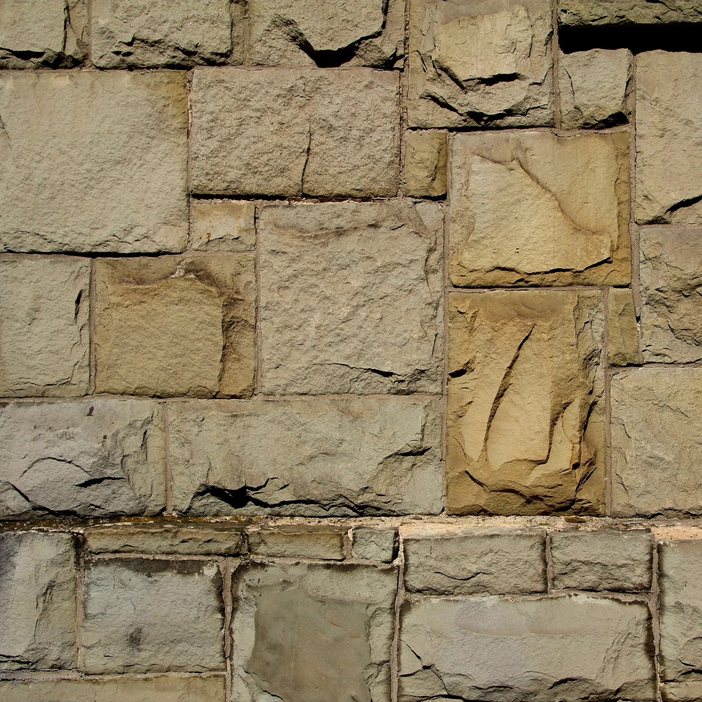 Mur de blocs de pedra grisa